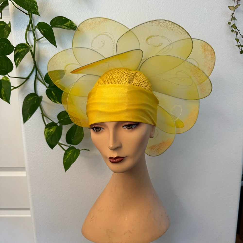 Handmade yellow floral hat. This hat was made for the stage in the theater.